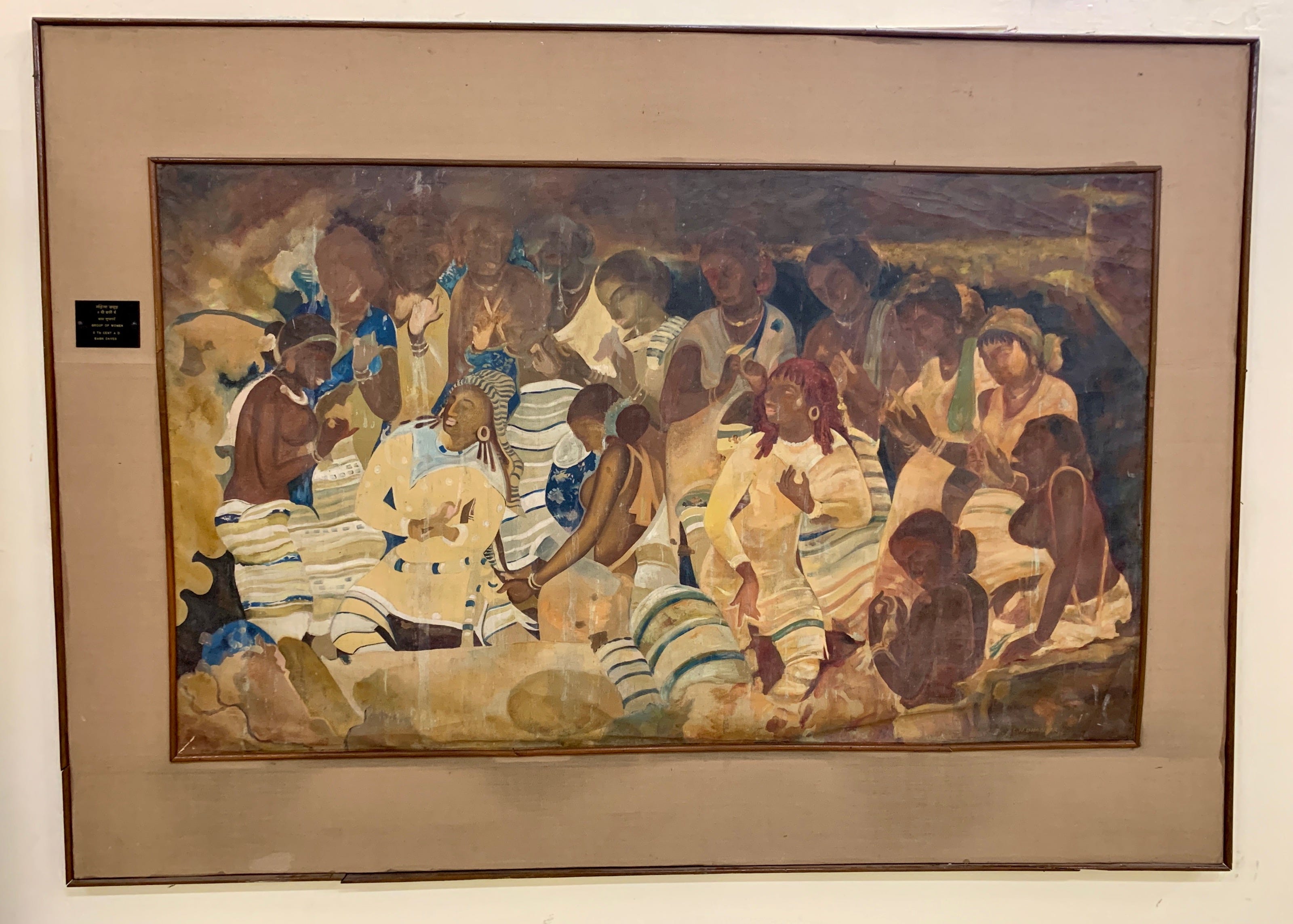 A painting showing a dozen ancient women in a cave in various positions, presumably a snapshot of the folk dance being depicted.